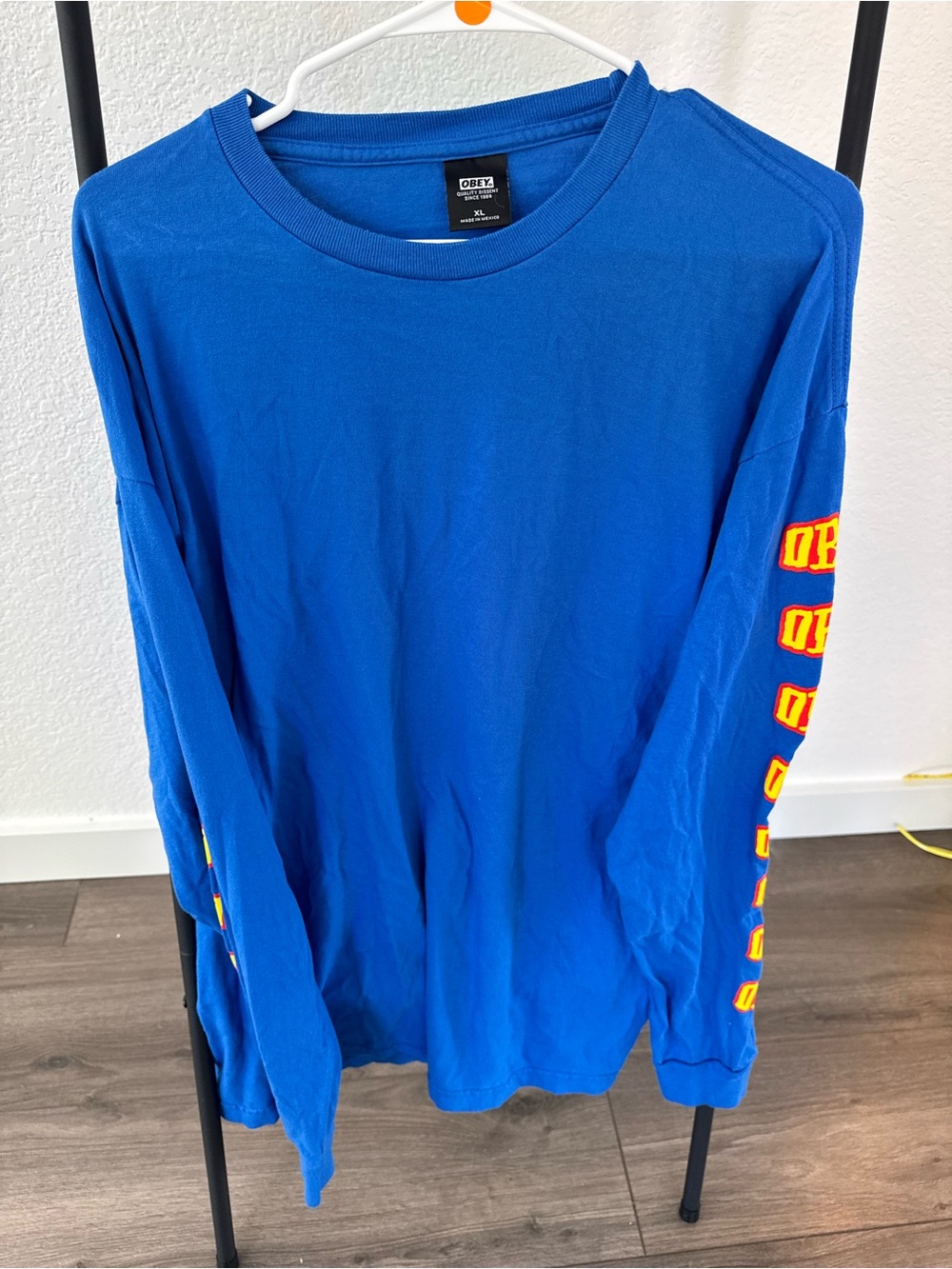 Obey Men’s Long Sleeve Tee in Bright Blue with Yellow Sleeve Logo